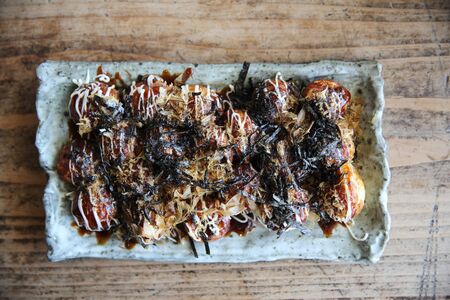 Takoyaki on wood background , japanese food