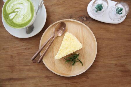 cheesecake japanese style with green tea on wood background