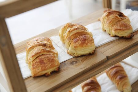 croissant on wood backgroundの写真素材