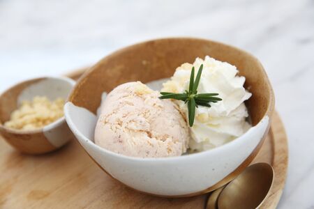 ice cream with cream on woodの写真素材