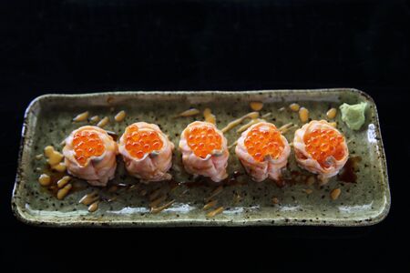 Salmon sushi ball with salmon caviarの写真素材