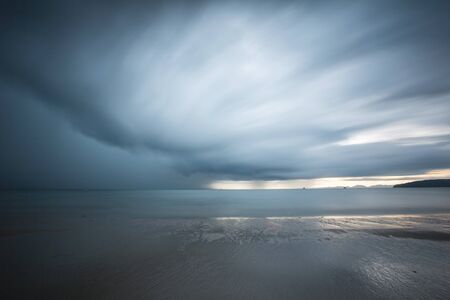 Blue sky in raining with beachの写真素材