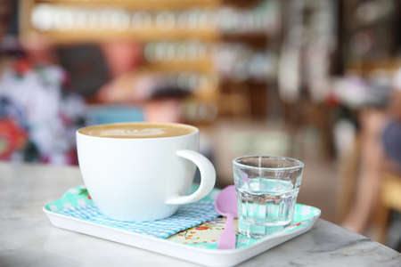 cappuccino coffee on wood backgroundの写真素材