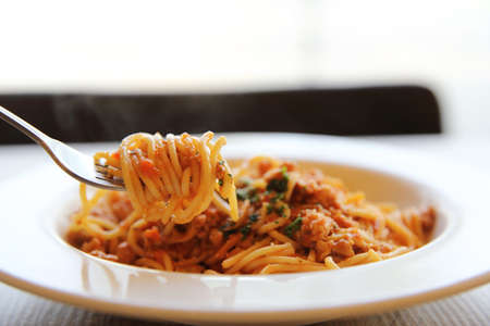 spaghetti bolognese meat sauce on woodの写真素材