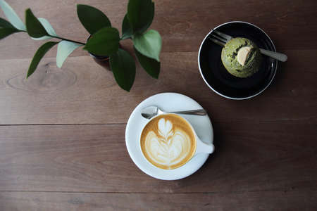 cappuccino coffee on wood backgroundの写真素材