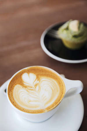 cappuccino coffee on wood backgroundの写真素材