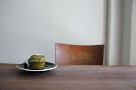 Green tea Muffin on woodの写真素材