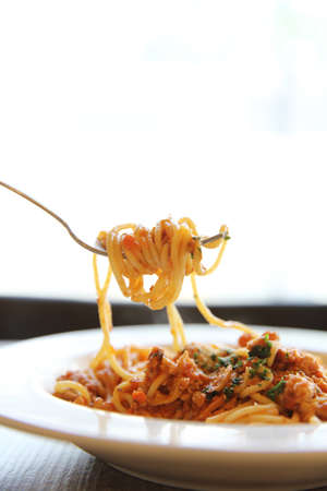 spaghetti bolognese meat sauce on woodの写真素材