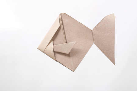 Origami Fish papercraft by recycle paper isolated in white backgroundの写真素材
