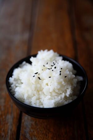 Rice on wood backgroundの写真素材