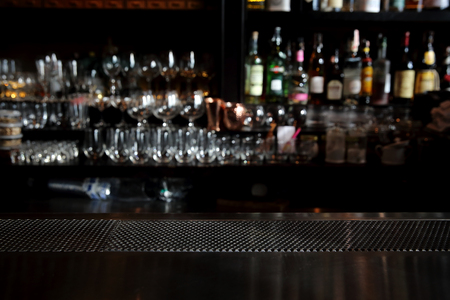 Counter bar with glass background in dark toneの写真素材