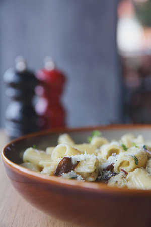 pasta mushroom truffle oil on wood background , Rigatoni pasta noodle with truffle oil mushroom and cheese , Italian foodの写真素材