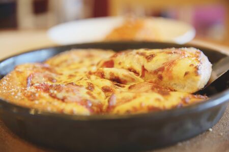 Pepperoni pizza , pizza with pepperoni mozzarella cheese and tomatoes with sauce background italian foodの写真素材
