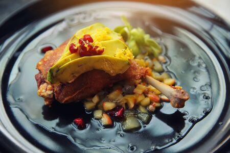 duck confit in black tone foodの写真素材