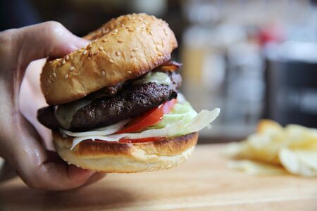 Beef hamburger on wood backgroundの写真素材