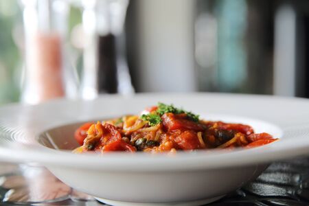 Spaghetti witn tomato and olive , Italian foodの写真素材