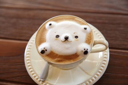 Latte coffee with bear on topの写真素材