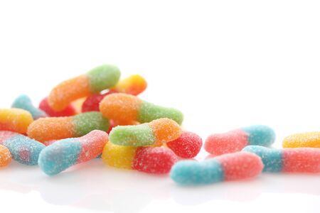 Colorful gummy jelly sugar candies close up isolated in white background の写真素材