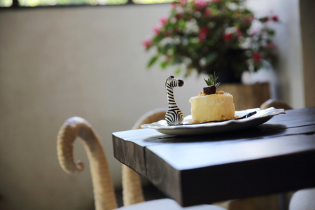 Cheese cake with blueberry jam sauce sweet food on wood backgroundの写真素材