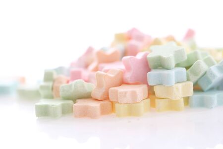Colourful Star Milk pellets isolated in white background