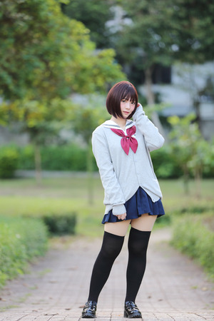 Portrait of Japanese school girl with countryside parkの写真素材