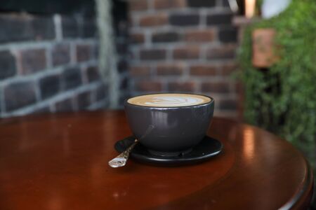 Cappuccino coffee break on wood backgroundの写真素材