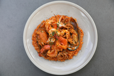 Seafood risotto with mussel shrimp and squid, Italian food on top viewの写真素材