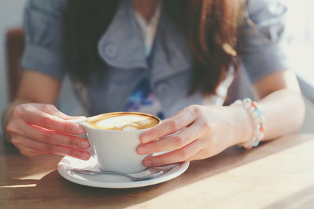 Cappuccino coffee break on wood backgroundの写真素材