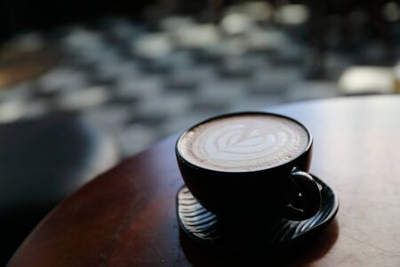 Cappuccino coffee break on wood background