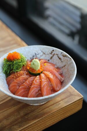 Salmon sushi don on wood background , Japanese foodの写真素材