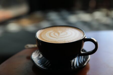 Cappuccino coffee break on wood backgroundの写真素材