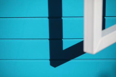 Blue wall with windowの写真素材