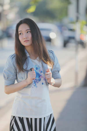 Portrait asian woman with our door park nature backgroundの写真素材