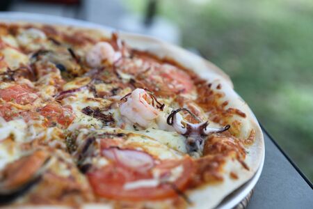 Seafood pizza , with mussel squid shrimp and tomato , italian foodの写真素材