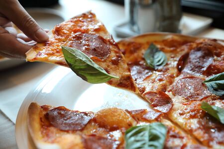 Hot Pepperoni Pizza in dish , Italian foodの写真素材