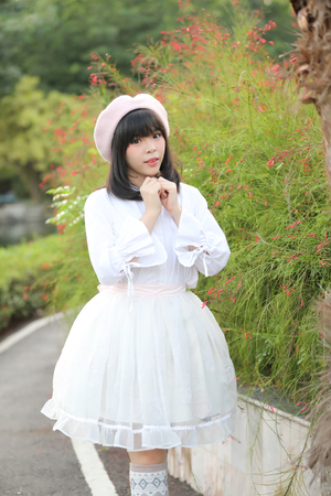 portrait asian woman lolita dress on nature parkの写真素材
