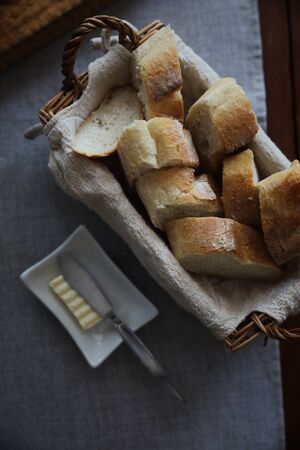 French bread baguettes in wood basket the wooden background 