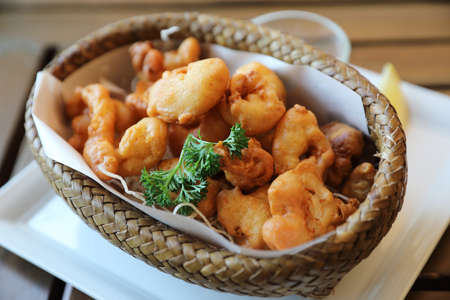 Calamari rings , fried squid on wood background , Italian foodの写真素材