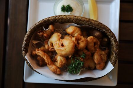 Calamari rings , fried squid on wood background , Italian foodの写真素材