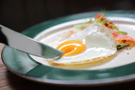 Zucchini fritters with egg on wood background vinage styleの写真素材