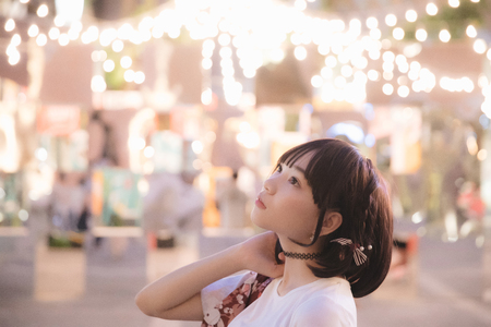 portrait of asian girl with white shirt and skirt looking in outdoor nature vintage film styleの写真素材