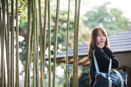 Portrait of asian japanese school girl costume looking at park outdoor film vintage styleの写真素材