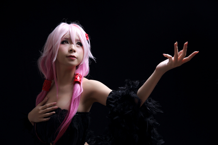 Portrait of Japan anime cosplay girl isolated in black backgroundの写真素材