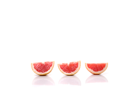Grapefruit sliced isolated in white backgroundの写真素材
