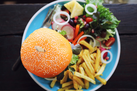 Beef hamburger fastfood on wooden tableの写真素材