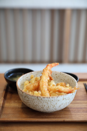 Tempura donburi , Fried shrimp tempura on rice japanese food on wooden tableの写真素材
