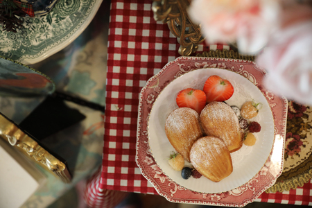 Madeleines , French sweet dessert with fruits and teaの写真素材
