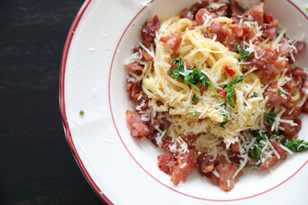Spaghetti white sauce (Spaghetti Carbonara) with bacon and garlic , on wood table backgroundの写真素材