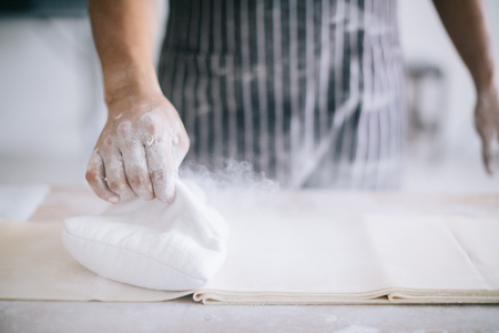Making Handmade Noodles on wood background