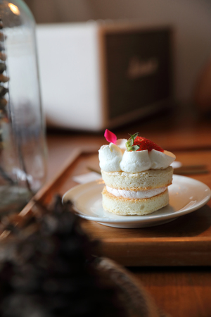 Strawberry cake dessert on wood tableの写真素材